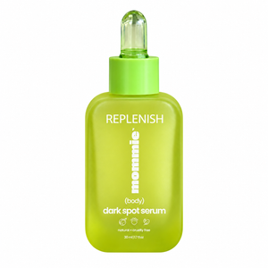 Mommie Dark Spot Serum in a green bottle on a white background